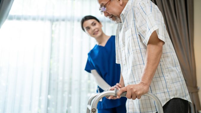 patient-walking-slowly-walker