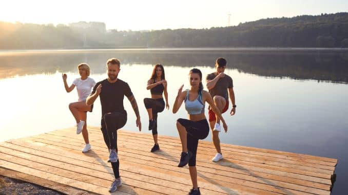 Young energetic people during group sports