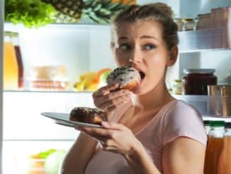 wary-woman-eating-unhealthy-food