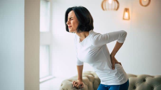 chronic-back-pain-adult-woman chronic-back-pain-adult-woman