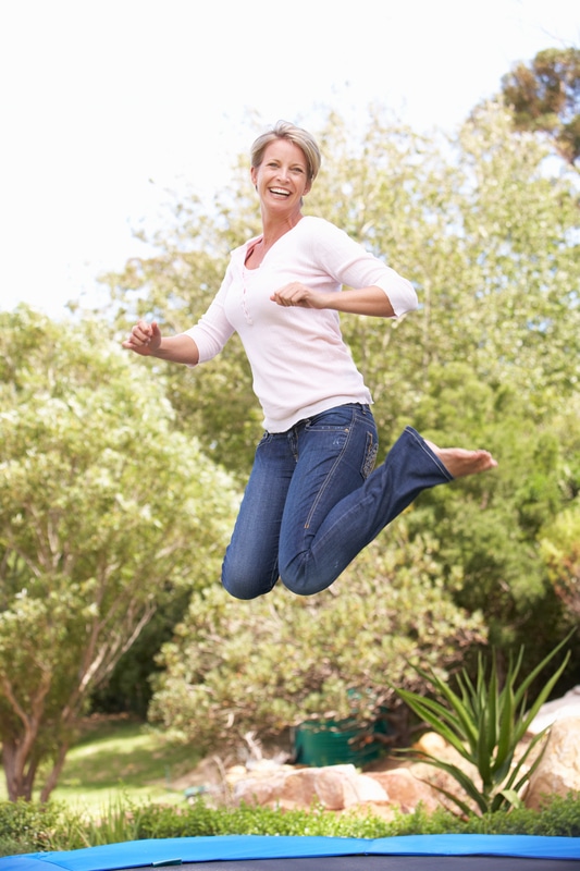 woman-jumping-trampoline