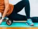 woman-using-foam-roller-massager