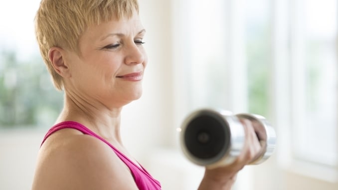 senior woman with dumbbell