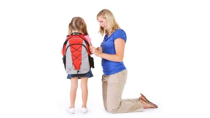 mother-helps-girl-backpack