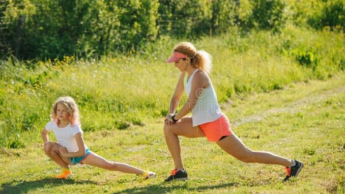 family-doing-physical-exercises-outside-stretching-stretching-hips-family-doing-physical-exercises-outside-standing-grass (2)