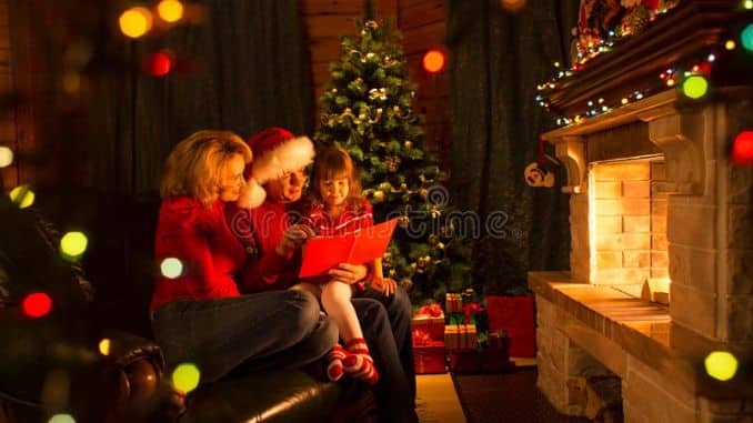 happy-family-reading-book-home-fireplace-warm-cozy-living-room-winter-day-christmastime
