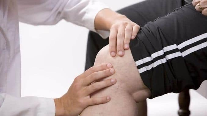 Physical-Therapist-Checks-knee