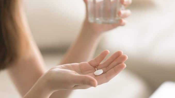 woman-takes-medicines