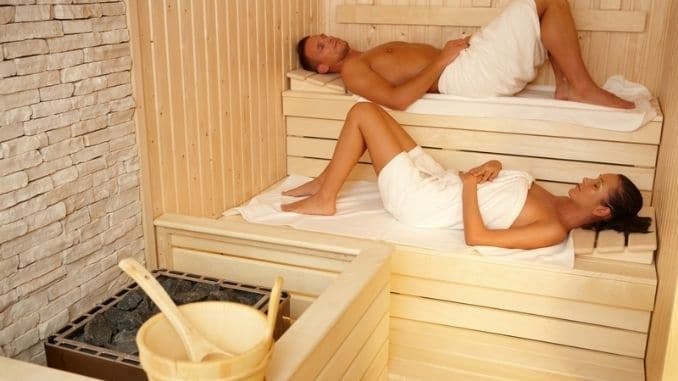 Couple-lying-in-sauna - 
Explore the question, "Are Saunas and Steam Rooms Healthy?" Uncover their well-being benefits in this informative dive.