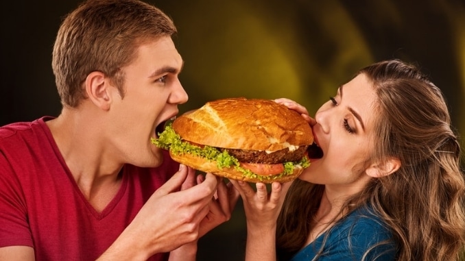 Man-and-woman-treat-hamburger