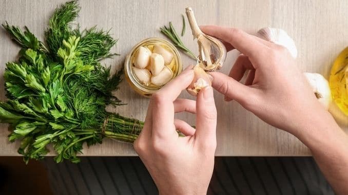 woman-peeling-garlic