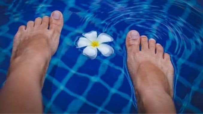 feet-on-swimming-pool