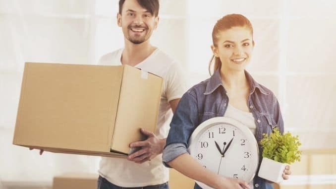 Happy-couple-Unpacking-Boxes - Side Hustles to Bring in Extra Money