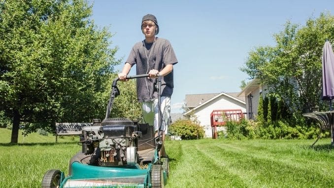 teenage-boy-mowing