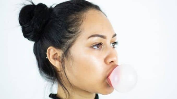 woman-making-bubble - Why Your Jaw Feels Stiff and How to Relieve It
