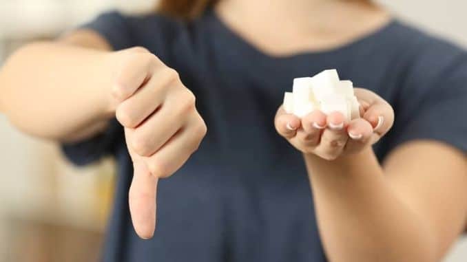 Woman-holding-sugar-cubes - Ways to Strengthen Your Immune System