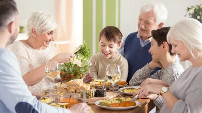 Happy big family eating dinner