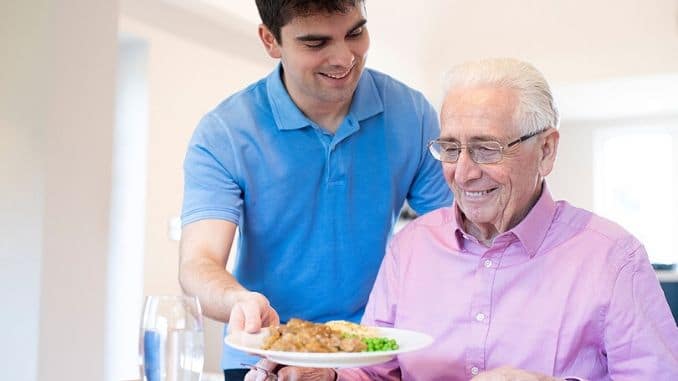 Carer-Serving-Lunch