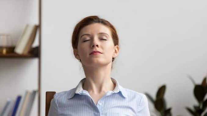 Relaxed-Businesswoman - 14 Ways to Stay Calm During Stressful Situations
