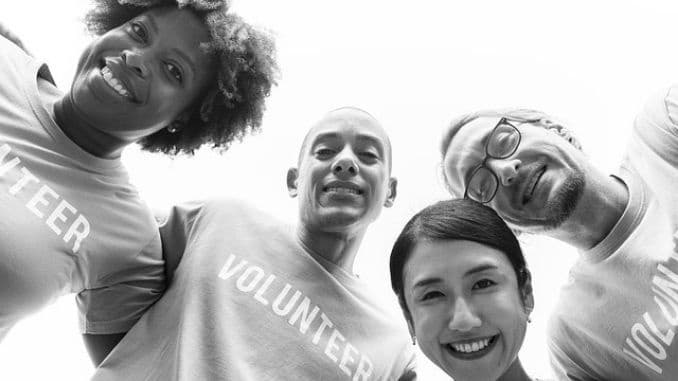 caucasian-charity-community - Volunteering Provides Health Benefits