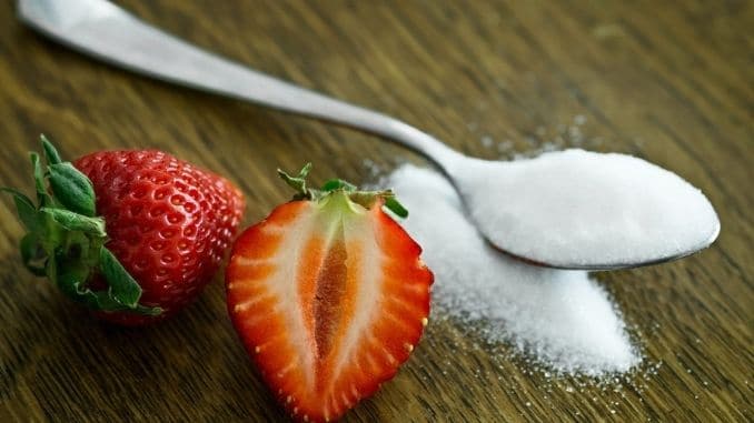 strawberry-beside-spoon-of-sugar