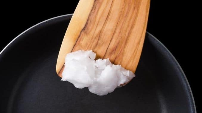 Coconut oil on wooden spatula