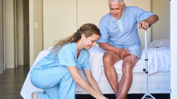 geriatric-nurse-helps-senior