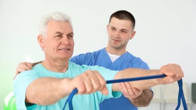 physiotherapist-working-senior-patient
