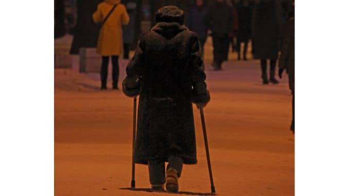 elderly woman leaning two sticks walks winter park-Exercises To Prevent Falls In Seniors