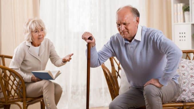 senior man knee arthritis men caring wife