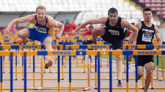 men-athletes-compete-hurdles