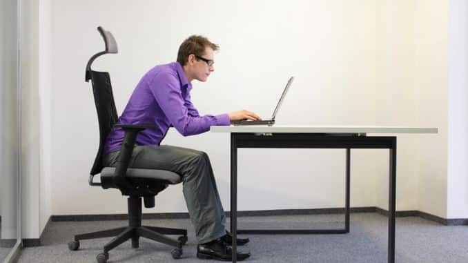 Shortsighted businessman bad sitting posture- Ergonomics
