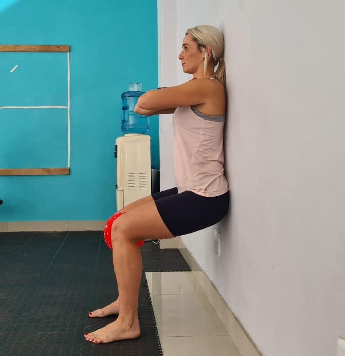 Wall squats with ball squeeze 2