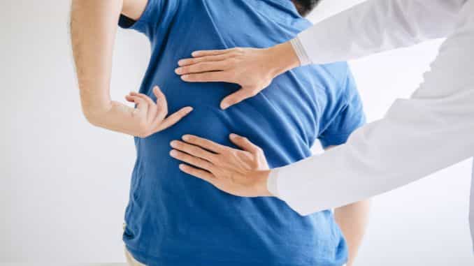 physiotherapist-treating-lower-back-pain