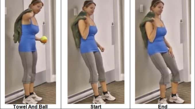 Rolling the Back With a Small Ball and Towel Against the Wall