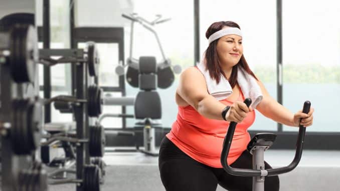 Overweight Woman on an Exercise Bike